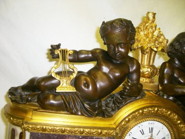 Exceptional French Louis xvi ormolu & patinated bronze mounted Porphry clock with Two reclining boys (3)