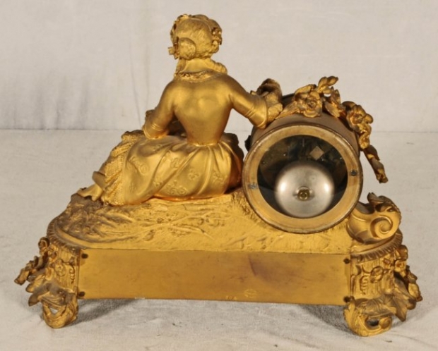 19c French porcelain mounted ormolu clock with reclining woman (1)